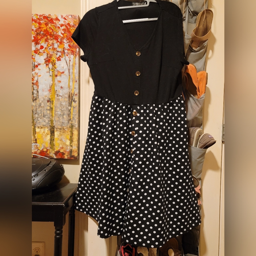 Ronni Nicole Black dress with white polka dots on skirt size XL. Hits top of kn